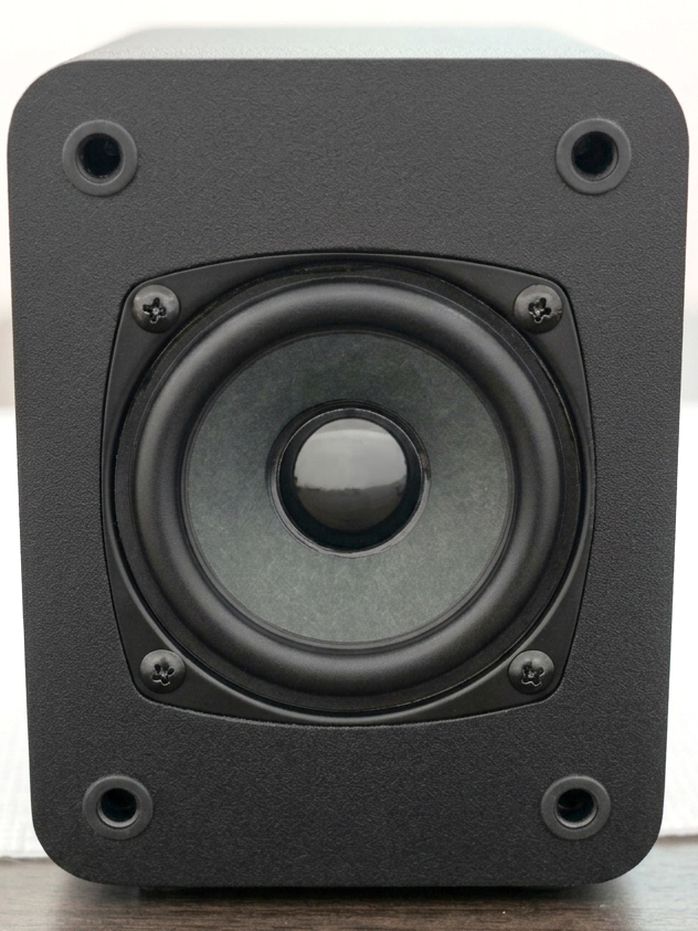 HouseWaves-One — compact modern bookshelf speaker with soft rounded edges and black mesh grille