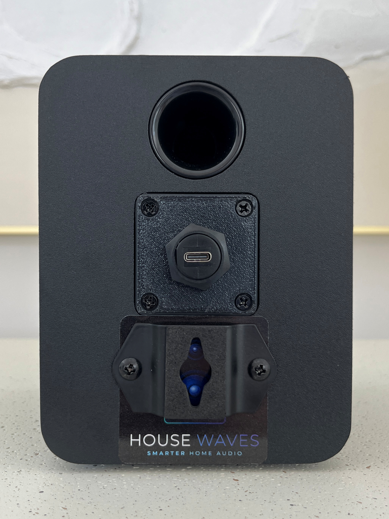 HouseWaves One rear view — USB-C power input and bass port opening